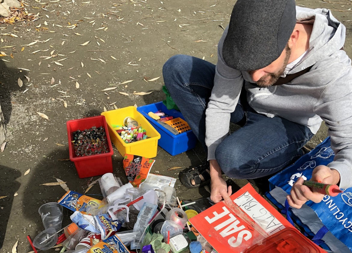 community member takes part in shoreline cleanup
