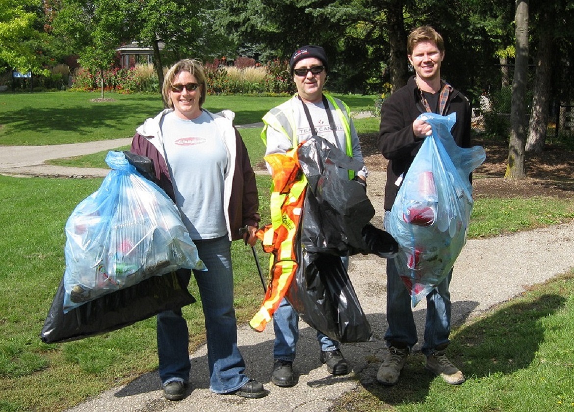 corporate team members take part in litter cleanup event